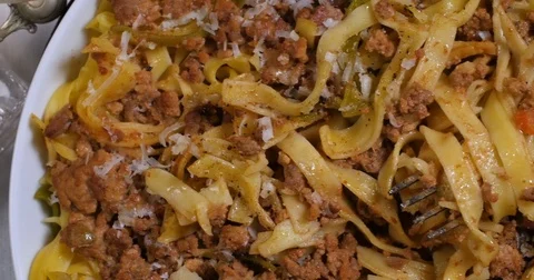 Dolly top down close up view of delicious steamy fettuccine in bolognese sauce Stock Footage 74070030