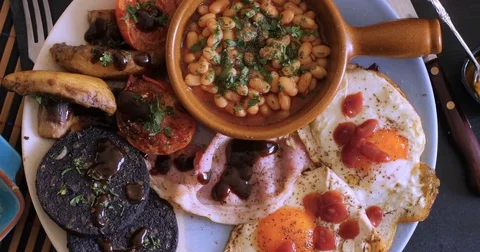 Dolly top down close up view of a full cooked English breakfast Stock Footage 74567944