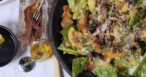 Dolly top down close up view of a delicious Caesar's salad Stock Footage 75005295