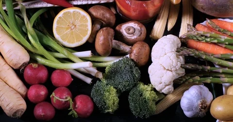 Dolly top down close up view of an assortment of fresh, organic vegetables Stock Footage 75270187