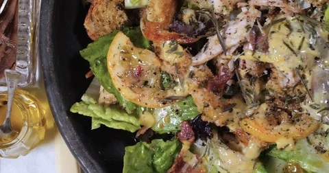Dolly top down close up view of a delicious Caesar's salad Stock Footage 76446274