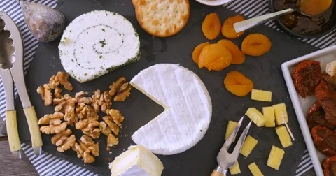 Dolly top down view of an assortment of French and British cheese Stock Footage 72826913