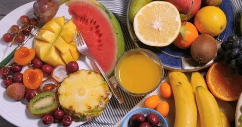 Dolly top down view of an assortment of fresh, healthy, organic fruits Stock Footage 73729924