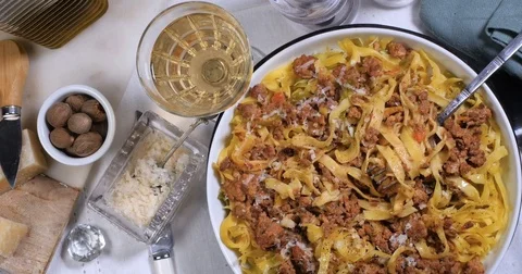 Dolly top down view of delicious steamy fettuccine in bolognese sauce Stock Footage 74570470