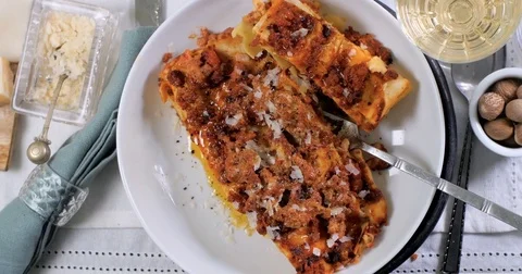 Dolly top down view of delicious steamy lasagne in bolognese sauce Stock Footage 74570719