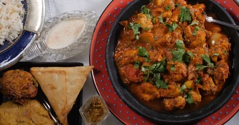 Dolly top down view of a delicious chicken tikka masala with Indian spices Stock Footage 75780984