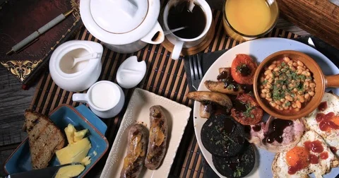 Dolly top down view of a mighty full English cooked breakfast Stock Footage 72622141
