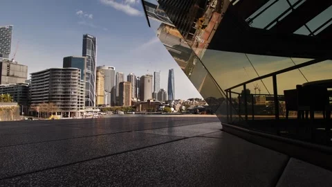 Dolly towards reflection of digger in Sydney Opera House window 4K Stock Footage 251181488