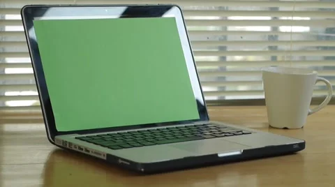 Dolly track out - in from Laptop computer notebook with green screen monitor Stock Footage 56930630