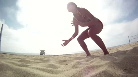 A dolly tracking panning slow motion shot of a female beach volleyball player di Video stock 68038929