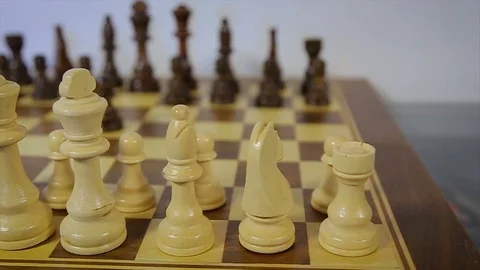 Dolly, tracking shot of a chess party. White against black. Backlash Video stock 79109741
