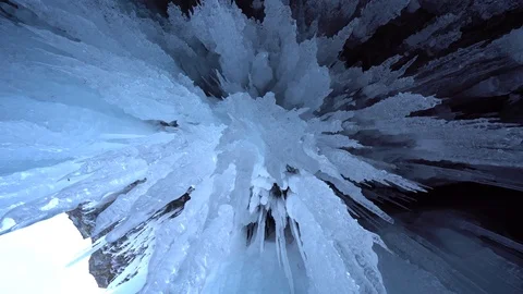 Dolly transparent blue sharp ice details cave splashes Winter Arctic Russia Stock Footage 88266923