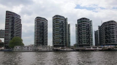 Dolly view of a contemporary riverside real estate development in West London Stock Footage 63611793