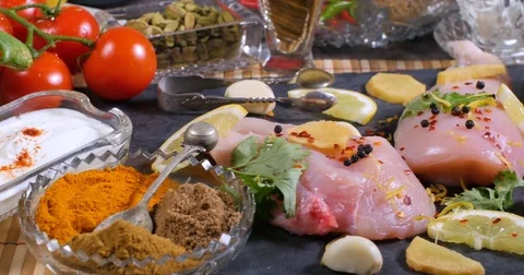 Dolly view of ingredients and indian spices for chicken tikka masala Stock Footage 77148016