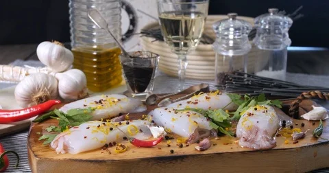 Dolly view of ingredients for black pasta with squids (cuttlefish) and ink Stock Footage 75006282