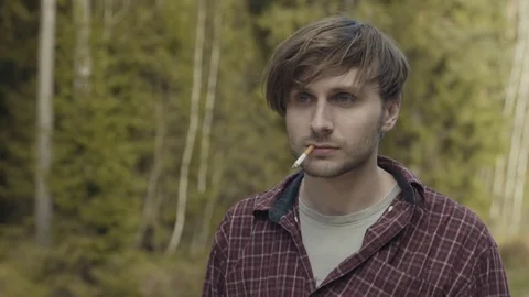 Dolly zoom effect of a shocked man with a cigarette in his mouth Stock Footage 81370925