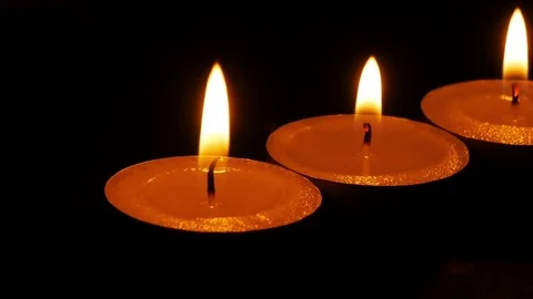 Dolly,Close up candle is burning on black background. Stock Footage 81220466