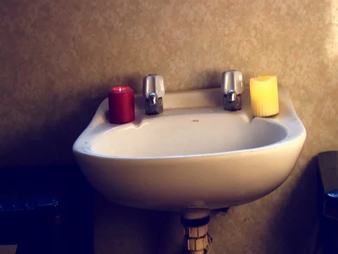 Dolly/crane in to bathroom sink Stock Footage 80214492