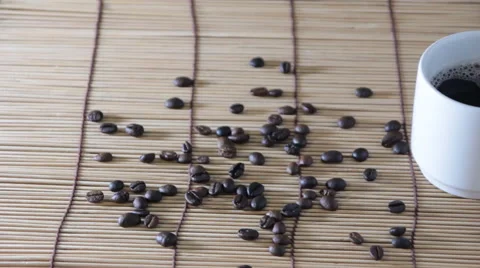 Dolly:Cup of coffee on the background of roasted coffee Video stock 50325680