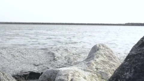 Dollyshot through stones in a harbor Stock-Footage 78563845