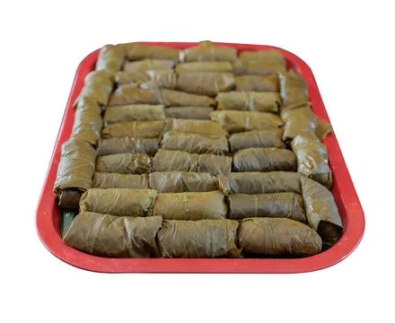 Dolma or sarma made from grape leaves lies Stock Photos