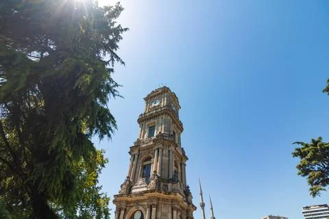 Dolmabahce Clock Tower with clear blue sky. Stock Photos