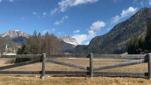Dolomite Alps. This rustic style fence surrounds a thermal source. Stock Footage 239343655