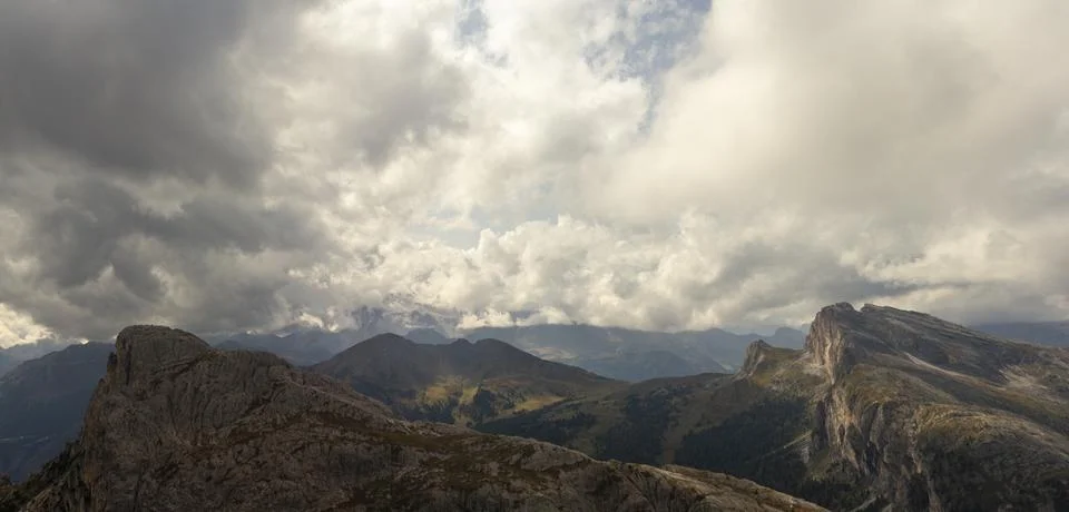 Dolomites dramatic cloudscape above rugged limestone peaks sweeping alpine .. Stock Photos