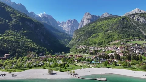 Dolomites Drone Flight Over Alpine Lake and Scenic Mountain Village Vídeo Stock 337159947