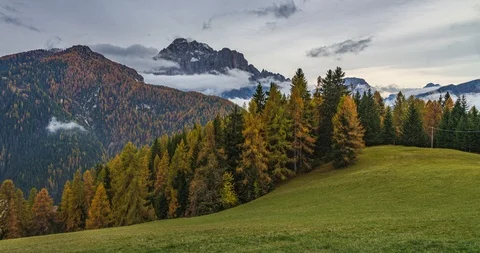 DOLOMITES, ITALY: Clouds around the Mount Civetta during sunset in autumn Stock Footage 121506661