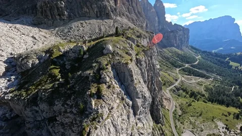 Dolomites lime stone mountain range and cliff surfing. Smooth rock and green Stock Footage 208831376