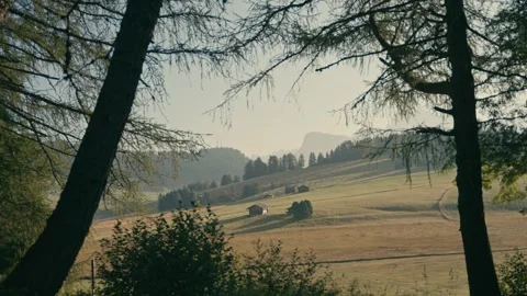 Dolomites Mountain Landscape with Alpine Huts at Sunrise During a Scenic Walk Stock Footage 331164005