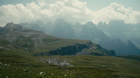 Dolomites Mountains Landscape with Rolling Grassy Hills and Cloudy Skies Vídeos de archivo 331169924