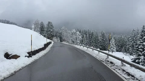Dolomiti - Paneveggio - UNESCO World Heritage - frozen snaky road with snow Stock Footage
