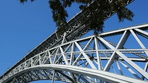 Dom Luis Bridge over Douro River in Porto, Portugal. Pan down under bridge Stock Footage 104994371