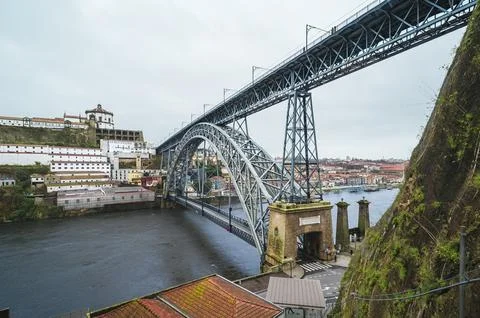Dom Luis I Bridge spanning Douro River in Porto cityscape, funicular view. Photos