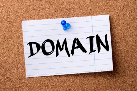 DOMAIN - teared note paper pinned on bulletin board Fotos Stock