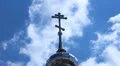 Dome and cross on a background of blue sky HD-videomateriaal
