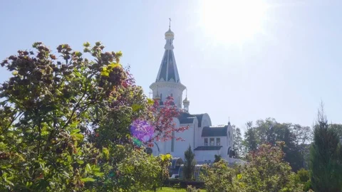 Dome of the Church and leaves. The silhouette of the cross and church bell to Stock Footage