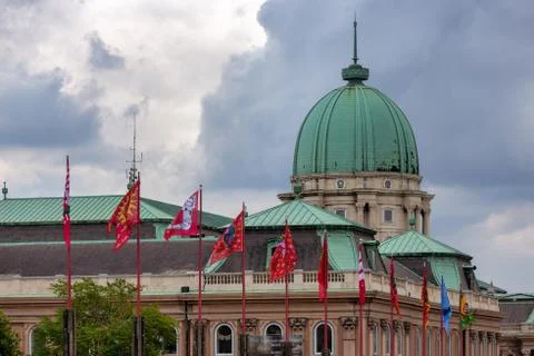 Dome historical museum Budapest with flags and overcast Stock Photos