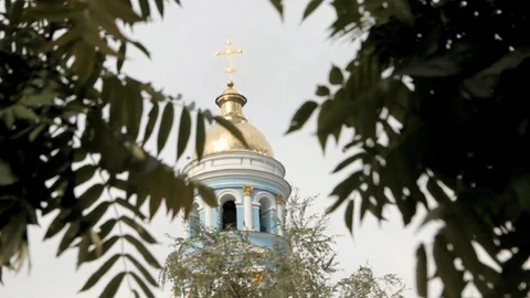 Dome of the Orthodox temple between the leaves of the tree Stock Footage 123623994