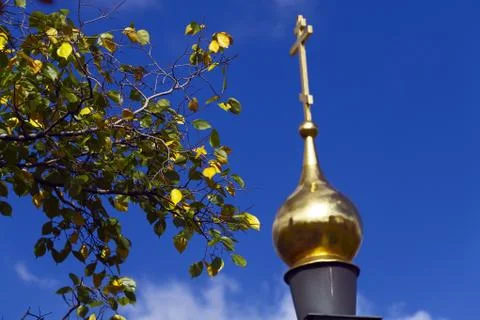 Dome of ortodox chirch and spring leaves Stock Photos