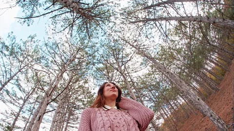 Dome from the pines trees at sky background overhangs over the young woman She Stock Footage 129604550
