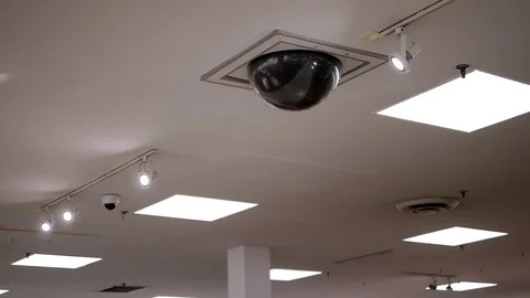 Dome security camera on top of ceiling inside Sears store Stock Footage 70708075