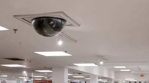 Dome security camera on top of ceiling inside Sears store Stock Footage 71329547
