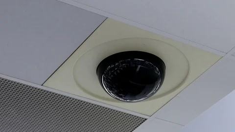 Dome security camera on top of ceiling inside store 動画素材 73128609