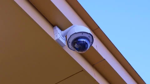 Dome security camera on top of ceiling outside Walmart store Stock Footage 90885746