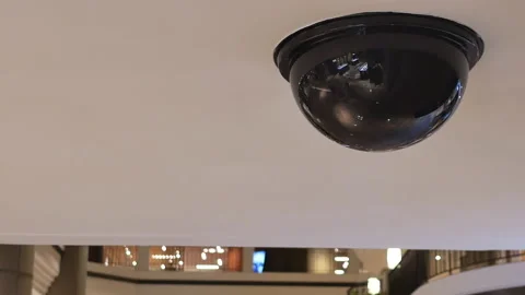 Dome security camera on top of ceiling inside mall Stock Footage 94979273