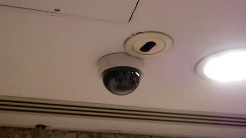 Dome security camera on top of ceiling inside mall with 4k resolution Stock Footage 99016443