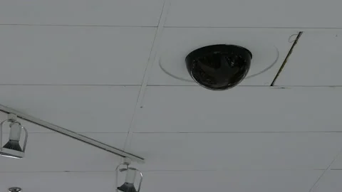 Dome security camera on top of ceiling inside mall with 4k resolution Stock Footage 121790159